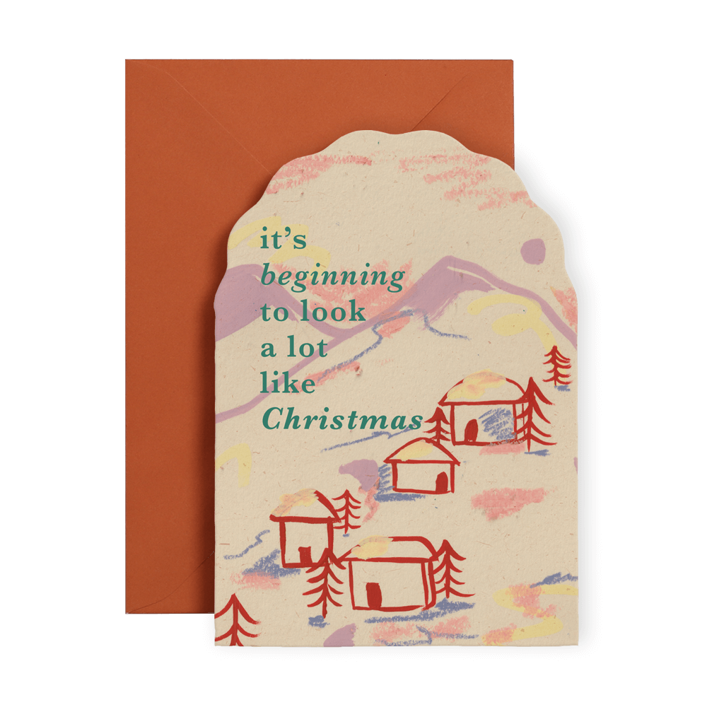 Christmas card by I am Roxanne and new for 2023, Features an abstract landscape of the mountains with hand painted coral houses and pine trees. Lots of mark making and playful scribbles in a quirky, vintage colour palette.