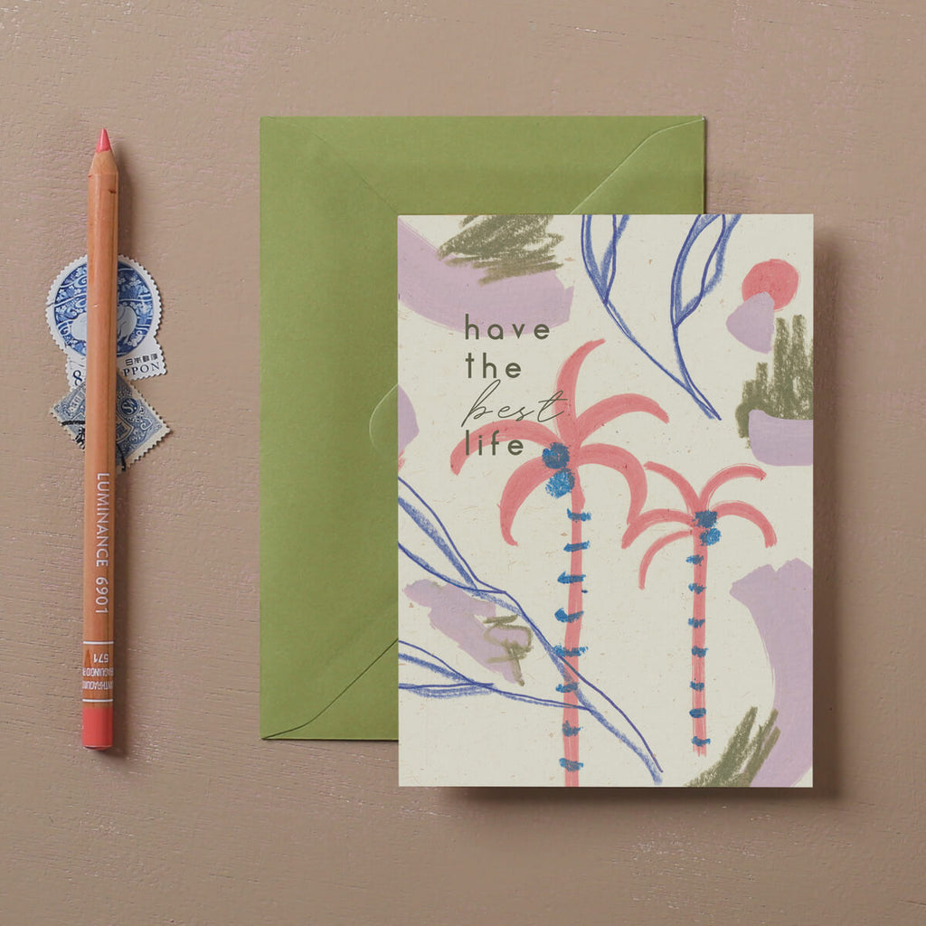 Greeting card with painted palm trees and abstract marks. With an olive green envelope and colouring pencil